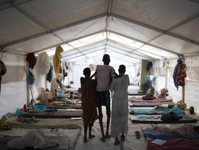 426224aa-9d18-4100-b473-1f787fa6eff1 A handout photo made available by the Medecins Sans Frontieres (MSF) on 19 January 2015 shows fifty six-year-old kala azar patient, Ruai Puot Malow (C) being assisted by his wife Yakuony Jock Deng (R) and a relative at MSF hospital in Lankien, South Sudan, 13 January 2015. The conflict that erupted in South Sudan little more than a year ago has left people more vulnerable to a deadly tropical kala azar disease, also known as black fever. Last year, MSF treated over 6,700 cases of kala azar in South Sudan, more than double the number of cases it treated the year before (2714 cases treated in 2013). Kala azar is a tropical, parasitic disease transmitted through bites from certain types of sand fly. EPA/KAREL PRINSLOO / MEDECINS SANS FRONTIERES / HANDOUT