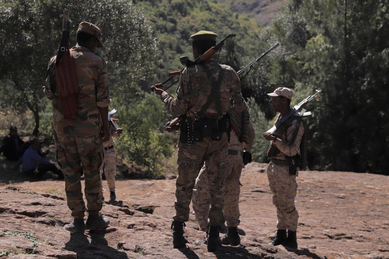 4582-3-1693320780 Members of the Amhara Special Forces stand guard next to the Saint George rock-hewn church in the Lalibela town of the Amhara Region, Ethiopia, January 25, 2022. Picture taken January 25, 2022. REUTERS/Tiksa Negeri