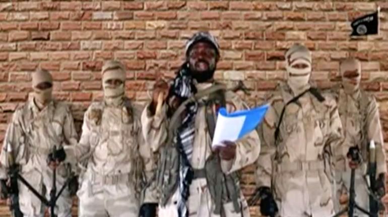 4849-1718129510 Leader of one of the Boko Haram group's factions, Abubakar Shekau speaks in front of guards in an unknown location in Nigeria in this still image taken from an undated video obtained on January 15, 2018. Boko Haram Handout/Sahara Reporters via REUTERS ATTENTION EDITORS - THIS IMAGE WAS PROVIDED BY A THIRD PARTY. MANDATORY CREDIT.