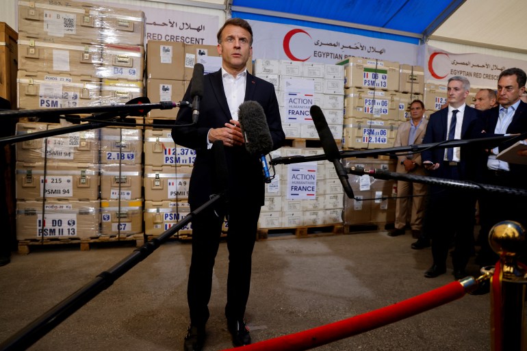 afp_67f567d98f92-1744136153 France's President Emmanuel Macron delivers a speech in front of humanitarian aid destined to Gaza, at the Egyptian Red Crescent warehouse in Egypt's northeastern city of Arish in the north of the Sinai peninsula, about 55 kilometres west of the border with the Gaza Strip, on April 8, 2025.