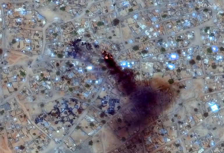 afp_6804ff422610-1745157954 This handout image courtesy of Maxar Technologies taken on April 16, 2025 and released on April 17, 2025, shows fire and smoke at Zamzam camp near the besieged Darfur city of El-Fasher.