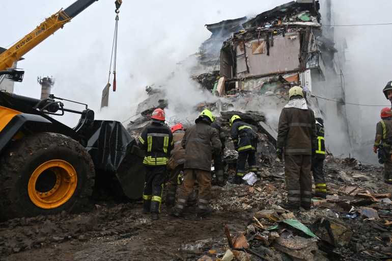 afpneru-1738427165 Firefighters dismantle the rubble of a damaged building following a missile strike in Poltava, on February 1, 2025, amid the Russian invasion of Ukraine. (Photo by SERGEY BOBOK / AFP)