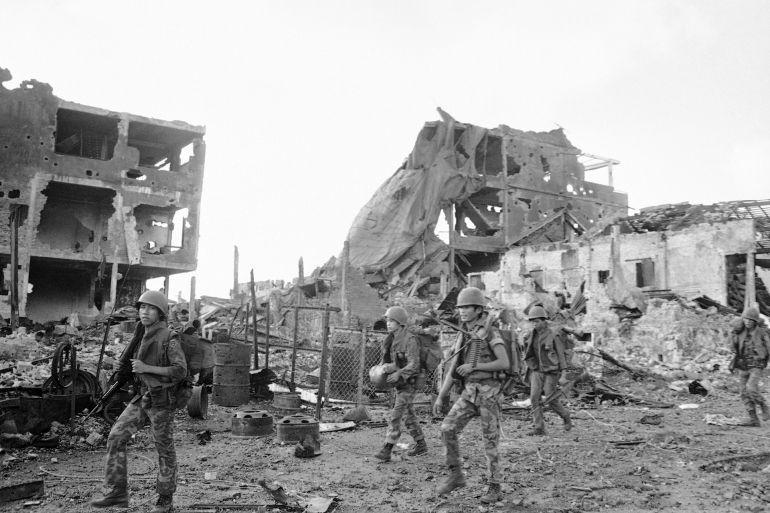 ap242068582589-1745930723 South Vietnamese rangers patrol past destroyed buildings in besieged An Loc, 60 M. No. of Saigon on Thursday, June 15, 1972. Buildings were destroyed by heavy North Vietnamese artillery barrages and allied air strikes over last two months. (AP Photo/Lo Hung)