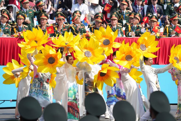 ap_6811af5c1ebf5-1745989468 Vietnamese dancers perform during a parade celebrating the 50th anniversary of the end of the Vietnam War in Ho Chi Minh City, Vietnam, Wednesday, April 30, 2025. (AP Photo/Achmad Ibrahim)