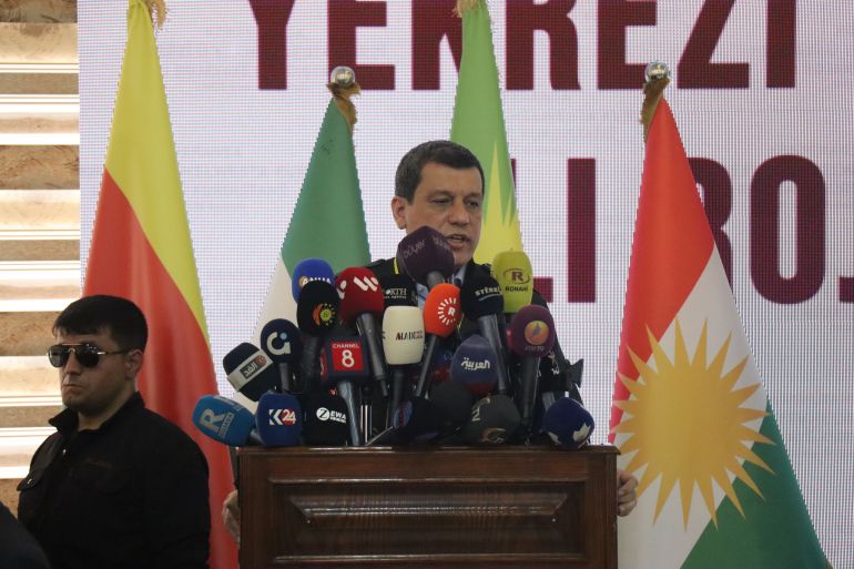 epa12056799 Mazloum Abdi, commander-in-chief of the Syrian Democratic Forces (SDF), speaks during the Kurdish National Conference, in Qamishli, northeast Syria, 26 April 2025. The conference titled 'Kurdish Unity and Position in Rojava Kurdistan' was launched, with the participation of more than 400 figures from Rojava, northern and southern Kurdistan, figures from several Syrian regions, and representatives of Kurdish and Kurdish parties and forces. EPA-EFE/AHMED MARDNLI