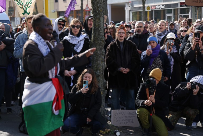 getty_67f64f9449-1744195476 BERLIN, GERMANY - APRIL 07: Demonstrators gather to protest against the possible deportation of four foreign pro-Palestine activists from Germany on April 07, 2025 in Berlin, Germany. The four activists, including two from Ireland, one from Poland and one from the United States, face charges relating to their participation in a protest sit-in at Berlin's Free University last year over Israel's invasion of Gaza. City authorities have ordered the four activists to leave Germany or face deportation. (Photo by Sean Gallup/Getty Images)