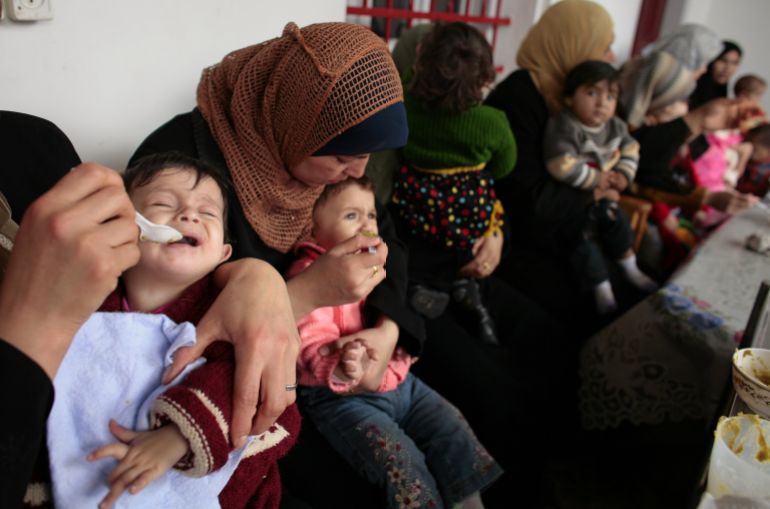 getty_680e03a043-1745748896 GAZA CITY, GAZA STRIP - APRIL 6: Palestinian mothers feed their babies during a feeding program at the Ard El Insan-Terres de Homme clinic on April 6, 2006 in Gaza City, Gaza Strip. The specilaized clinic deals with infants suffering from anemia and malnutrition due to lack of iron, vitamin D and calcium. A shortage of infant formula and the constant border closings make some food products for babies hard to come by along with the financial burdens that large Gaza families deal with daily. (Photo by Paula Bronstein/Getty Images)