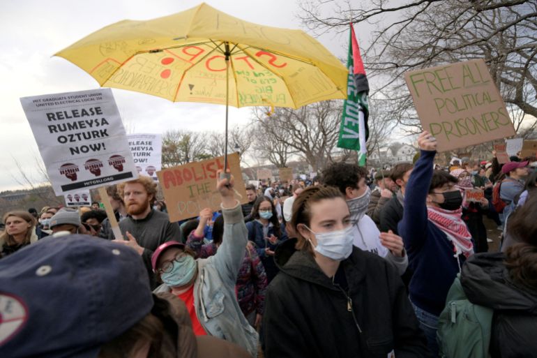 rc29lda44azn-1743235365 Demonstrators take part in the Stand with Rumeysa Ozturk,Tufts PHD Student emergency rally, at Powder House Square Park, after Ozturk was taken into custody by federal agents, in Somerville, Massachusetts, U.S. March 26, 2025. REUTERS/Faith Ninivaggi
