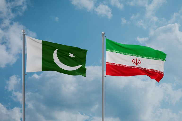 shutterstock_2393237865-1744565996 Iran and Pakistan flags waving together on blue cloudy sky; Shutterstock ID 2393237865; purchase_order: aj; job: ; client: ; other: