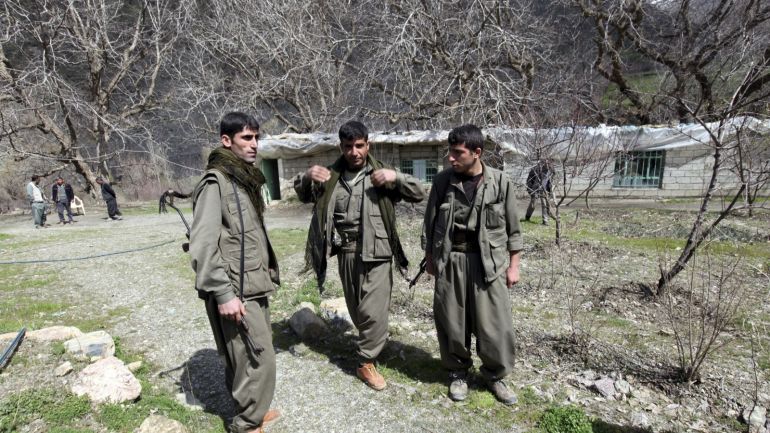 36ade274-a0ed-404f-a7e3-93e2fc5b38c8-1 Kurdistan Workers Party (PKK) fighters stand guard at the Qandil mountains near the Iraq-Turkish border in Sulaimaniya, 330 km (205 miles) northeast of Baghdad March 24, 2013. Shattered stone houses recall Turkish air strikes on Kurdish rebels holed up in the Qandil mountains of northern Iraq. Life is harsh amid the snowcapped peaks, supplies are sparse and armed forays across into Turkey perilous in the extreme. Yet rebel chief Abdullah Ocalan, who declared a ceasefire