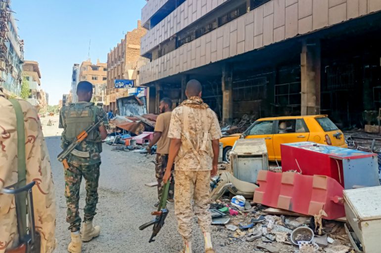 Army soldiers patrol a market area in Khartoum on March 24, 2025. For nearly two years, Sudan has been ravaged by a war between the regular army and the RSF, a conflict that has killed tens of thousands of people, uprooted over 12 million more and created the world's largest hunger and displacement crises. (Photo by AFP)