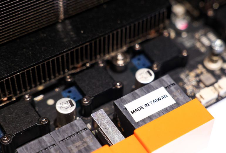 afp_68344c6ebb9e-1748257902 A section of a Nvidia RTX Pro server is displayed during a production preview exhibition in Taipei on May 21, 2025. (Photo by I-HWA CHENG / AFP)