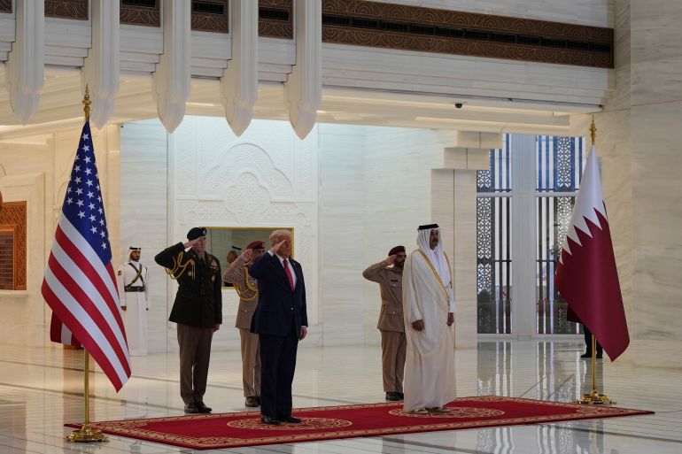 ap25134427704075-1747223938 President Donald Trump and Qatar's Emir Sheikh Tamim bin Hamad Al Thani take part in an official welcoming ceremony at the Amiri Diwan in Doha, Qatar, Wednesday, May 14, 2025. (AP Photo/Alex Brandon