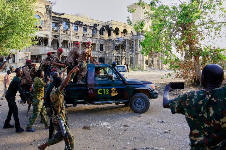 ap_68124d7f071ce-1746029951 Sudan's Amy troops deploy for the arrival of military chief Gen. Abdel-Fattah Burhan at the Republican Palace, recently recaptured from the Rapid Support Forces paramilitary group, in Khartoum, Sudan, Wednesday, March 26, 2025. (AP Photo)