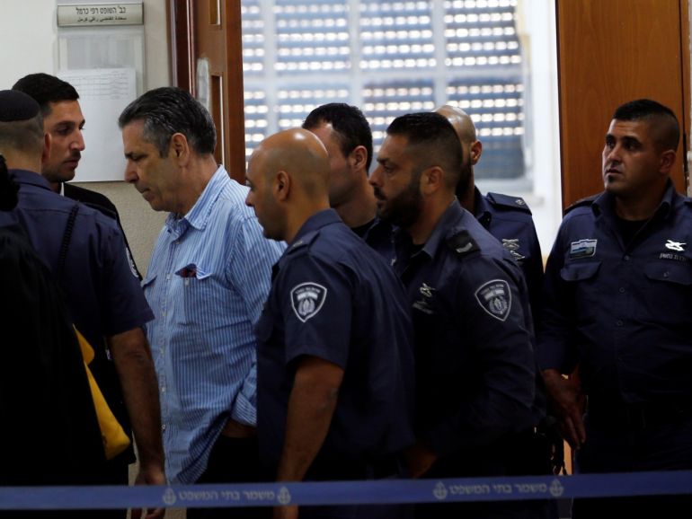 Gonen Segev, a former Israeli cabinet minister indicted on suspicion of spying for Iran, is escorted by prison guards as he leaves the court in Jerusalem, July 5, 2018 REUTERS/Ronen Zvulun