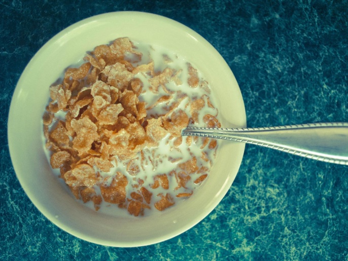 High angle close up of cereal with milk in bowl