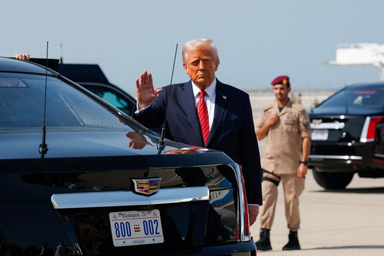d983d98ad983d983d98a-1-1747222410 U.S. President Donald Trump gestures upon his arrival at Hamad International Airport, in Doha, Qatar, May 14, 2025. REUTERS/Brian Snyder