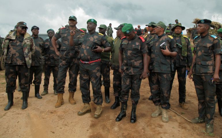 FILE PHOTO: Congolese army commander Jerome Chico Tshitambwe leads members of the Armed Forces of the Democratic Republic of the Congo (FARDC), as they assess the positions against the M23 rebel group in Lubero, North Kivu province of the Democratic Republic of Congo October 27, 2024. REUTERS/Djaffar Al Katanty/File Photo
