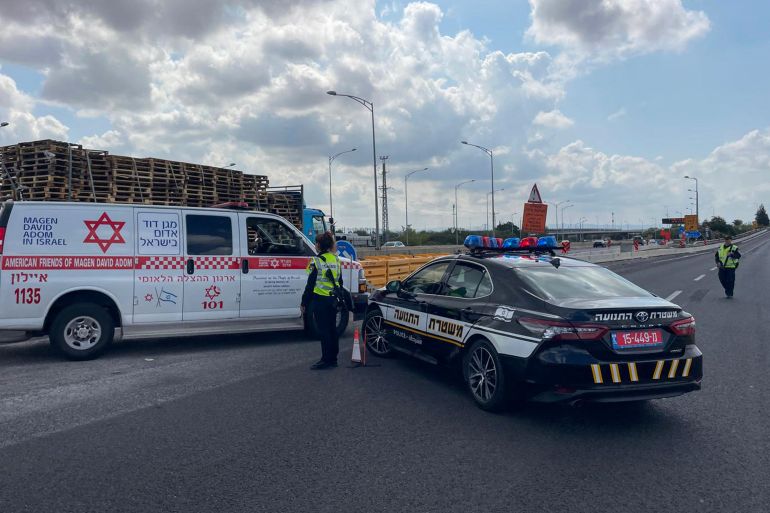Israeli police members allow an ambulance in as they block an entrance to Ben Gurion airport after the country activated air defences against a missile launched from Yemen on May 4, 2025. "Several attempts were made to intercept the missile launched from Yemen. A fall was identified in the area of Ben Gurion airport," a military statement said on May 4 without specifying what fell, while adding "the incident is under review". (Photo by Jack GUEZ / AFP)