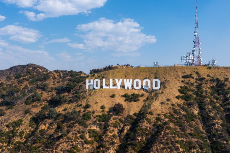 dsfsdfsd2-1746550797 Los Angeles, USA. July 20, 2024. The Hollywood Sign stands on Mount Lee in Los Angeles, California, surrounded by rugged terrain and sparse vegetation under a clear blue sky.; Shutterstock ID 2526925291; purchase_order: aljazeera ; job: ; client: ; other: