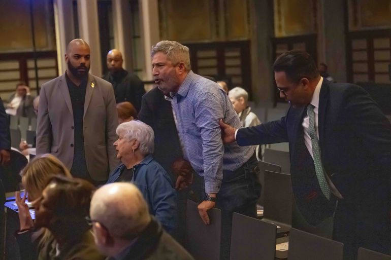 dtgg5-1748594380 NEW YORK, UNITED STATES - MAY 29: New York Public Library security remove a protestor from inside the venue as multiple demonstrators disrupted United States Senator Chuck Schumer’s book signing event inside New York Public Library in New York, U.S., May 29, 2025