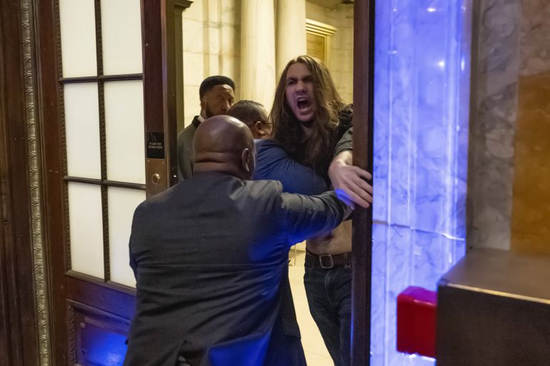 dty5-1748594386 NEW YORK, UNITED STATES - MAY 29: New York Public Library security remove a protestor from inside the venue as multiple demonstrators disrupted United States Senator Chuck Schumer’s book signing event inside New York Public Library in New York, U.S., May 29, 2025