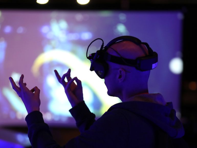 ec5a1a1a-cc9f-409a-97f6-0e53c342fe10 SANTA CLARA, CALIFORNIA - MAY 30: An attendee tries out Realmax augmented reality glasses during the AWE Expo (Augmented World Expo) at the Santa Clara Convention Center on May 30, 2019 in Santa Clara, California. The Augmented Word Expo highlights the latest virtual and augmented reality technology and features industry speakers. Over 7,000 people will attend the three day expo that runs through May 31. Justin Sullivan/Getty Images/AFP== FOR NEWSPAPERS, INTERNET, TELCOS & TELEVISION USE ONLY ==