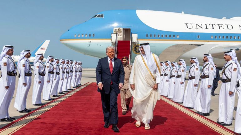 epa_6827670d67ad-1747412749 epa12099558 A handout photo made available by Qatar News Agency shows Qatar's Emir Sheikh Tamim bin Hamad al-Thani (R) welcoming US President Donald Trump upon his arrival in Doha, Qatar, 14 May 2025. EPA-EFE/QATAR NEWS AGENCY HANDOUT HANDOUT EDITORIAL USE ONLY/NO SALES