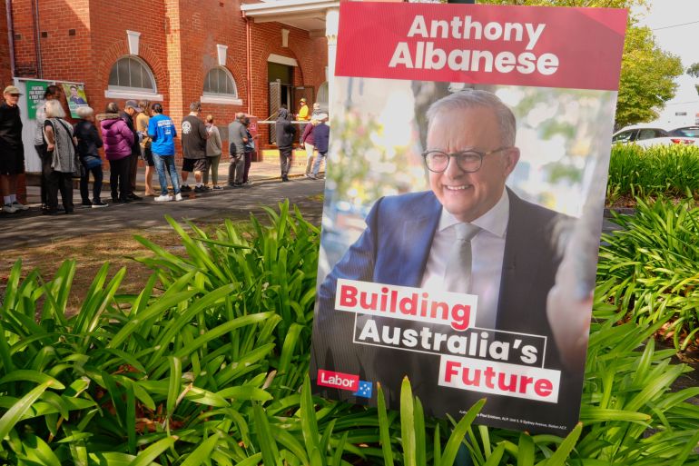 MELBOURNE, AUSTRALIA - APRIL 22: A placard of Prime Minister of Australia Anthony Albanese is posted outside an early voting centre in the suburb of Oakleigh in the federal seat of Hotham as people line up to cast their vote ahead of the Australian Federal Election on April 22, 2025 in Melbourne, Australia. ​Early voting opened Monday, allowing Australians to cast their ballots before the May 3 federal election. The practice has become increasingly popular, with up to half of voters expected to vote early this year, reflecting a long-term shift toward pre-poll participation. (Photo by Asanka Ratnayake/Getty Images)