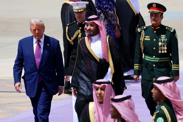 getty_6822f4d290-1747121362 RIYADH, SAUDI ARABIA - MAY 13: U.S. President Donald Trump is greeted by Saudi Crown Prince Mohammed bin Salman as he arrives at King Khalid International Airport on May 13, 2025, in Riyadh, Saudi Arabia. Trump begins a multi-nation tour of the Gulf region focused on expanding economic ties and reinforcing security cooperation with key U.S. allies. (Photo by Win McNamee/Getty Images)