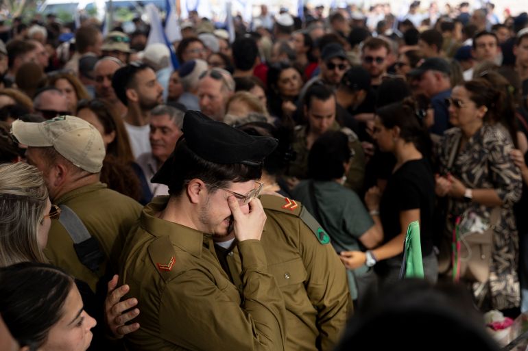 BEIT HASHMONAI, ISRAEL - APRIL 27: Israeli soldiers mourn during a funeral for Master Sergeant (res) Asaf Cafri killed in a battle in the northern Gaza Strip on April 27, 2025 in Best Hashmonai, Israel. According to the IDF, Cafri, a tank driver was hit and three other soldiers were wounded by sniper fire in the Beit Hanoun area, close to military post in the buffer zone. Beside Cafri, Police officer Sgt.Neta Yitzhak Kahane and commander Cpt. Ido Voloch were killed during fighting in Gaza City's Shejaiya neighbourhood, as IDF prepares for more offensive operation. (Photo by Amir Levy/Getty Images)