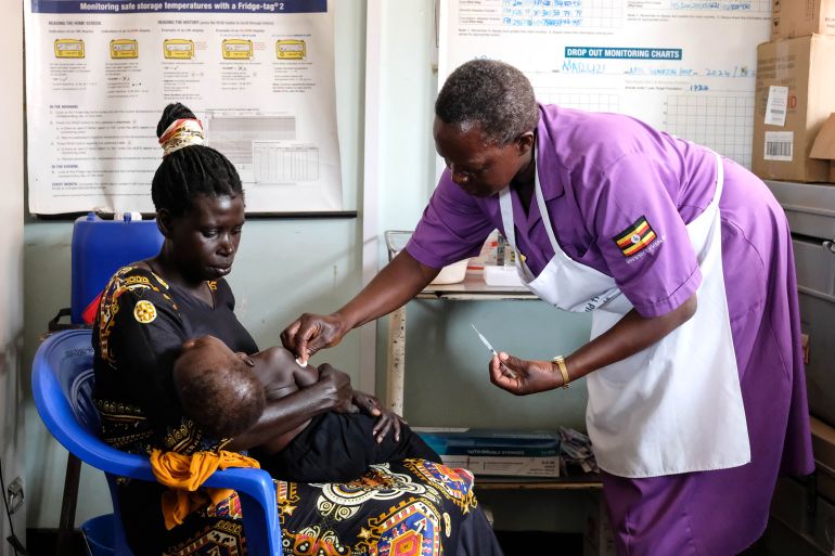 APAC DISTRICT, UGANDA - APRIL 8: Hellen Akullo, a nurse assistant prepares a syringe by drawing a dose of malaria vaccine at Apac General Hospital on April 8, 2025 in Apac District, Uganda. Uganda's Ministry of Health has begun the rollout of a massive malaria vaccine campaign that is expected to prevent at least 800 severe cases of malaria among children daily, with an initial target of vaccinating 1.1 million children under the age of two in the most affected districts of the East African nation. The R21/Matrix-M malaria vaccine is administered over four doses at 6, 7, 8, and 18 months and will be integrated into routine immunizations for young children, for whom the mosquito-transmitted disease is the leading cause of illness and death in Uganda. (Photo by Hajarah Nalwadda/Getty Images)