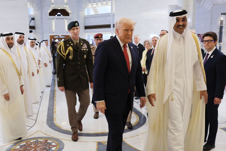 gettyimages-2214401156-1747224854 DOHA, QATAR - MAY 14: U.S. President Donald J. Trump participates in an arrival ceremony with Emir of Qatar Tamim bin Hamad al Thani at the Amiri Diwan, the official workplace of the emir, on May 14, 2025, in Doha, Qatar. The visit underscores the strategic partnership between the United States and Qatar, focusing on regional security and economic collaboration. (Photo by Win McNamee/Getty Images)