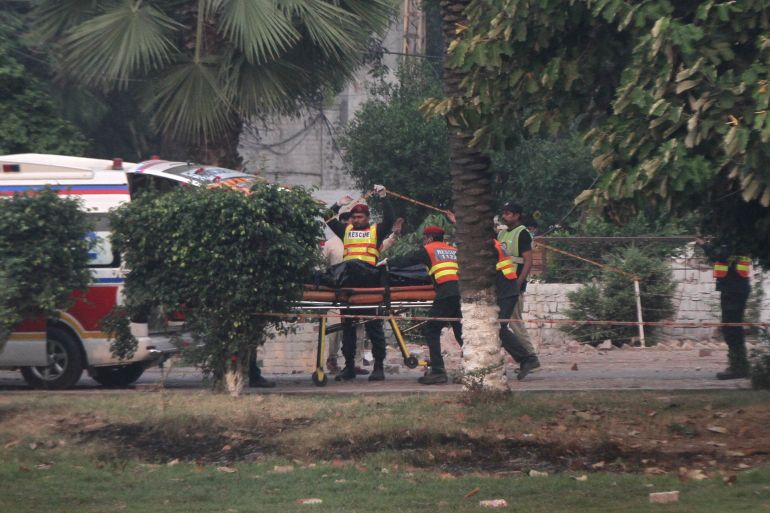 reuters_681b042c-1746601004 Rescuers wheel a body towards an ambulance after it was recovered from a building hit by an Indian strike in Muridke near Lahore, Pakistan, May 7, 2025. REUTERS/Mohsin Raza