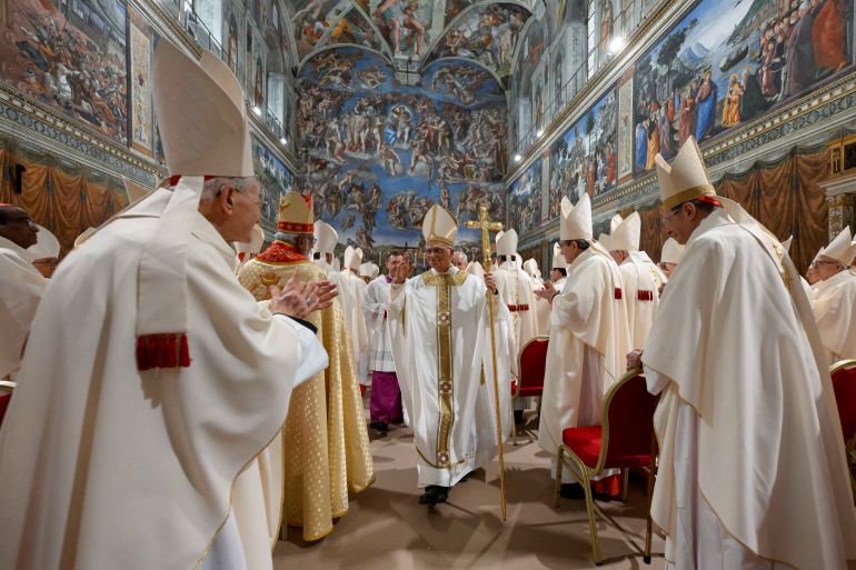 Pope Leo XIV walks in the Sistine Chapel at the Vatican, May 9, 2025. Vatican Media/Francesco Sforza ­Handout via REUTERS ATTENTION EDITORS - THIS IMAGE WAS PROVIDED BY A THIRD PARTY.