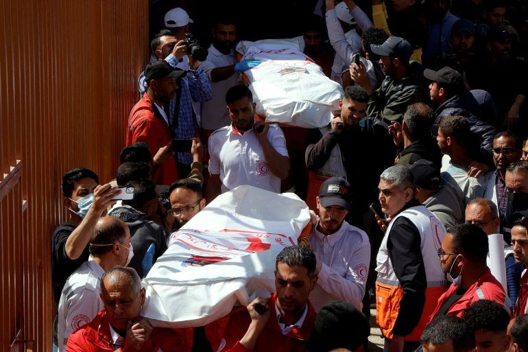 reuters_6821de5a-1747050074 FILE PHOTO: Palestinians mourn medics, who came under Israeli fire while on a rescue mission, after their bodies were recovered, according to the Red Crescent, at Nasser hospital in Khan Younis in the southern Gaza Strip March 31, 2025. REUTERS/Hatem Khaled/File Photo