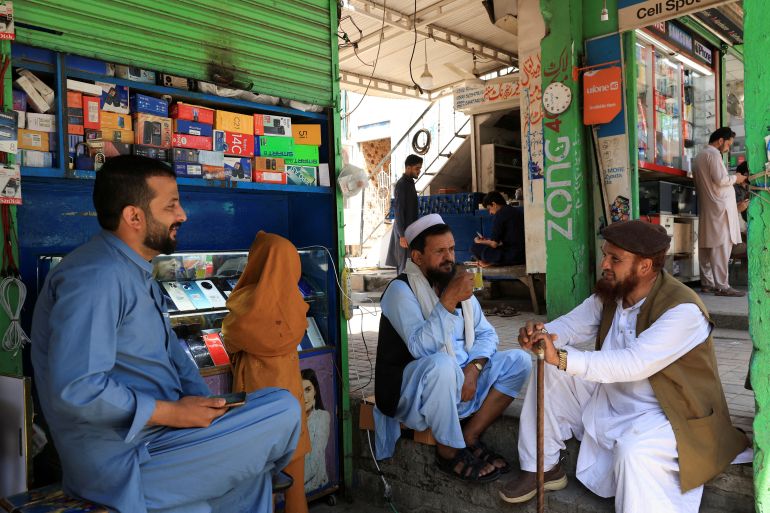 reuters_682241ca-1747075530 People sit outside a shop following the ceasefire announcement between India and Pakistan, in Islamabad, Pakistan, May 12, 2025. REUTERS/Akhtar Soomro