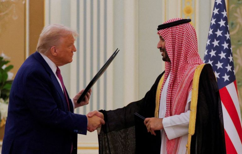 U.S. President Donald Trump and Saudi Crown Prince and Prime Minister Mohammed Bin Salman shake hands during a Memorandum of Understanding (MOU) signing ceremony at the Royal Court in Riyadh, Saudi Arabia, May 13, 2025. REUTERS/Brian Snyder TPX IMAGES OF THE DAY