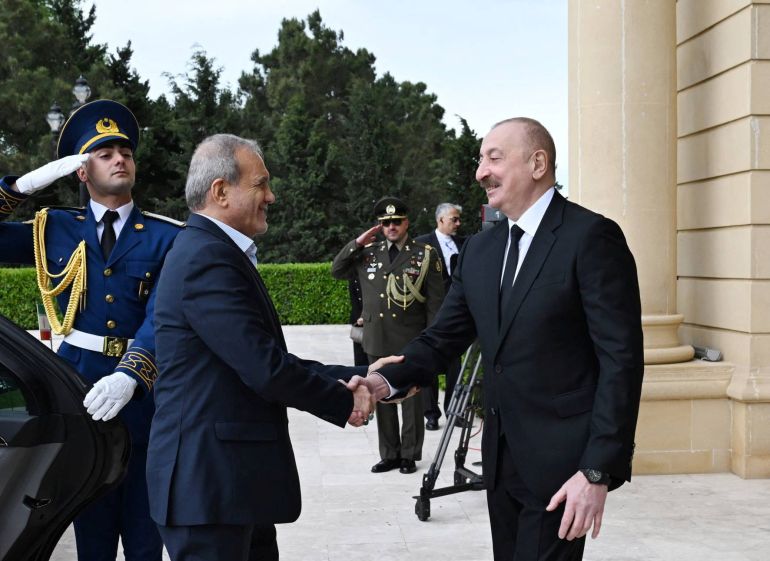 Azerbaijani President Ilham Aliyev greets Iranian President Masoud Pezeshkian during a meeting in Baku, Azerbaijan April 28, 2025. Official website of the President of the Republic of Azerbaijan/Handout via REUTERS ATTENTION EDITORS - THIS IMAGE HAS BEEN SUPPLIED BY A THIRD PARTY. NO RESALES. NO ARCHIVES. MANDATORY CREDIT.