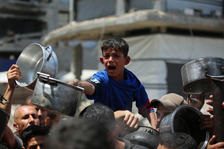 shutterstock_15281464y-1747045846 Palestinians, mostly children, wait in long lines with empty pots in hands to get a warm meal distributed by charitable organizations, n Beit Lahia, northern Gaza Strip, 03 May 2025. Amnesty International stated on Friday that the Israeli siege imposed on Gaza constituted a genocidal act and an unlawful collective punishment. "Israel must immediately end its devastating siege on the occupied Gaza Strip which constitutes a genocidal act, a blatant form of unlawful collective punishment, and the war crime of using starvation of civilians as a method of warfare," Amnesty International said in a press release. Photo by Omar Ashtawy apaimages