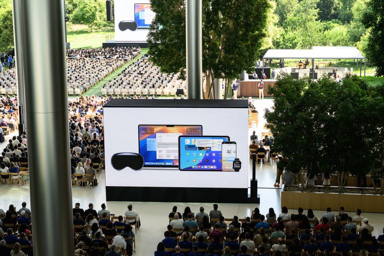 6-1749503483 Apple announces a new design language for its operating systems called "Liquid Glass" and other new products during the annual Apple "Worldwide Developers Conference" (WWDC) at Apple Park, the corporate headquarters of Apple Inc., in Cupertino, California on June 9, 2025. Pressure is on Apple to show it hasn't lost its magic despite broken promises to ramp up iPhones with generative artificial intelligence (GenAI) as rivals race ahead with the technology. Apple will showcase plans for its coveted devices and the software powering them at its annual Worldwide Developers Conference (WWDC) kicking off Monday in Silicon Valley and running through June 13. (Photo by Josh Edelson / AFP)