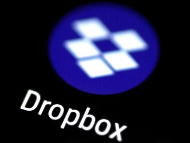 62e08eec-d800-4cb3-9502-76b73cd59961 The Dropbox app logo seen on a mobile phone in this illustration photo October 16, 2017. REUTERS/Thomas White/Illustration