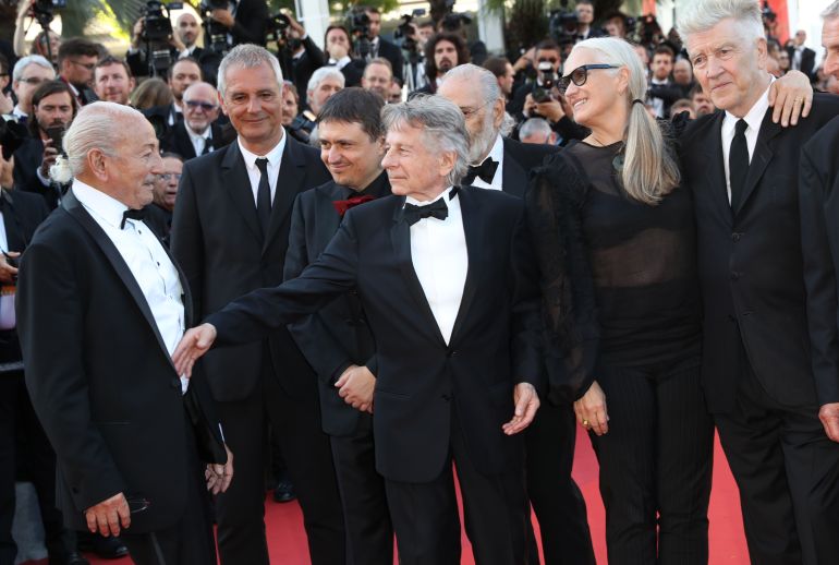 ap_6846fda512e91-1749482917 Previous former Palme d'or winners from left, Mohammed Lakhdar-Hamina, Laurent Cantet, Cristian Mungiu, Roman Polanski, Jane Campion and David Lynch pose for photographers upon arrival at the 70th anniversary of the film festival, Cannes, southern France, Tuesday, May 23, 2017. (AP Photo/Alastair Grant)