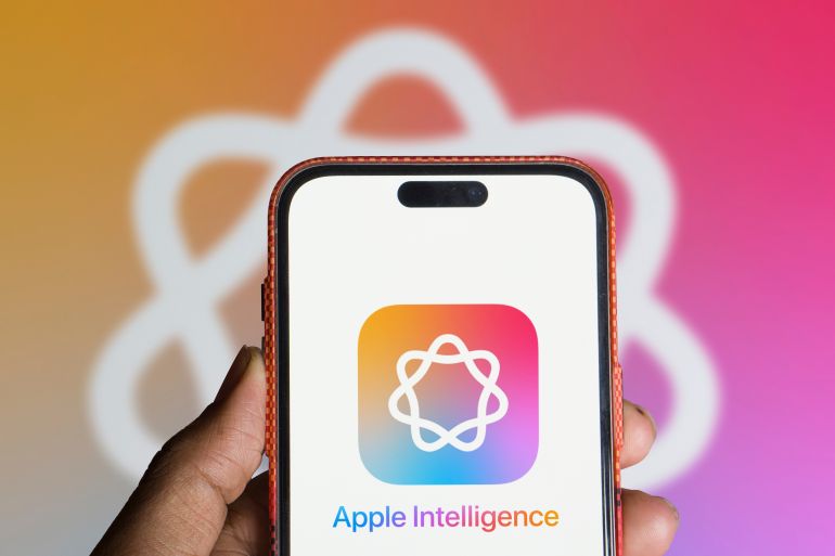 apple-intelligence1-1728985400 Dhaka, Bangladesh- 11 June 2024: Apple intelligence (AI) logo is displayed on iPhone.