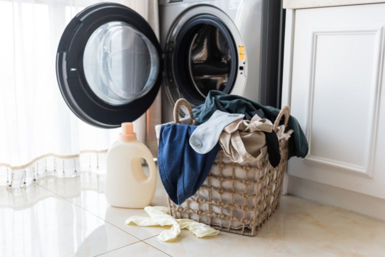 Laundry basket in front of washing machine