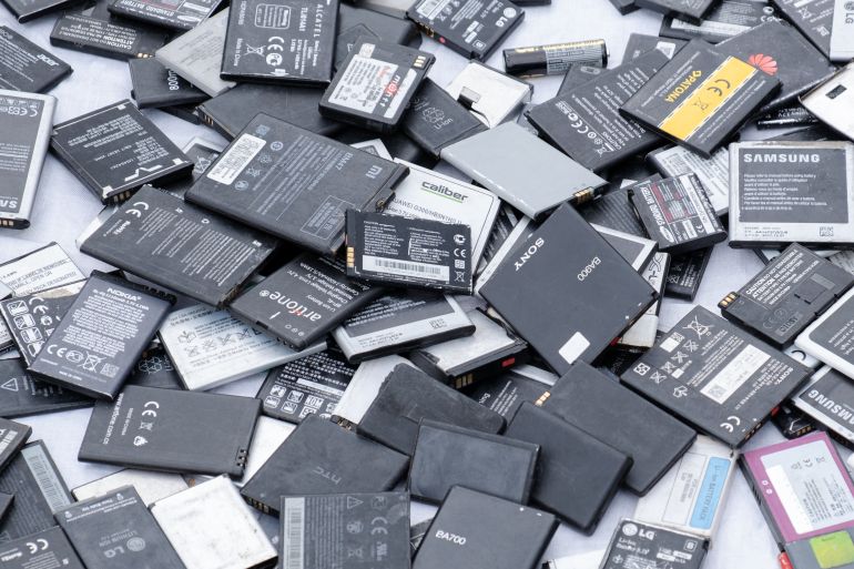 shutterstock_1962441793-1726723609 Prague, CZ 25 April 2021: Used cell mobile phone different brands batteries in the market. lot of Lithium rechargable Recycling lithium. EDITORIAL