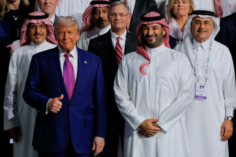 truump1-1747150566 U.S. President Donald Trump and Saudi Crown Prince Mohammed Bin Salman pose for a group photo during the Saudi-U.S. Investment Forum, in Riyadh, Saudi Arabia, May 13, 2025. REUTERS/Brian Snyder