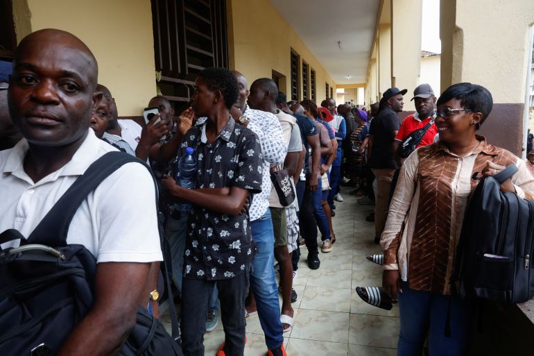People wait to cast their vote during the presidential election at a polling station inside a school in Libreville, Gabon April 12, 2025. REUTERS/Luc Gnago