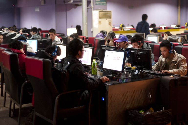 Young Chinese people use computers and play online video games in the interior room of a internet cafe in Chengdu, China on Jan 28, 2011. Cyber security,