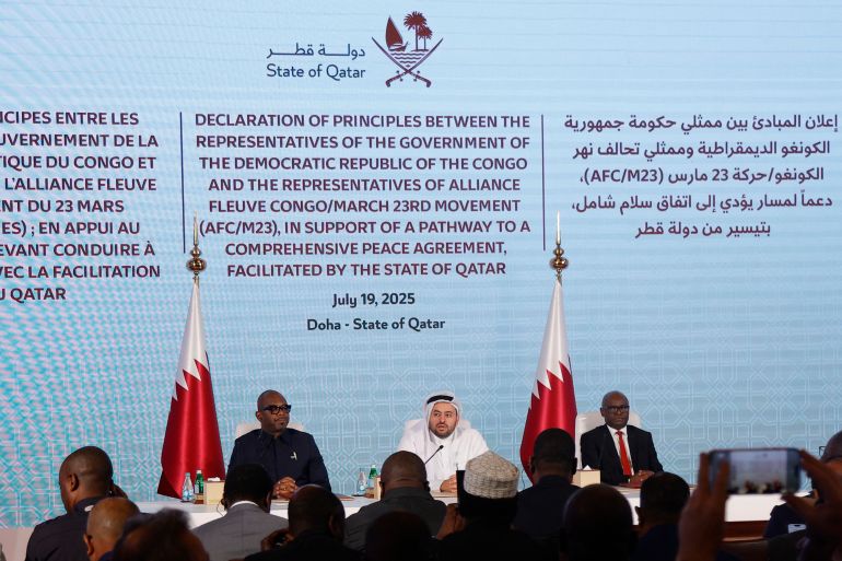 Qatar's chief negotiator Mohammed al-Khulaifi sits in the centre as the Democratic Republic of Congo and Rwanda-backed armed group M23 signed a ceasefire deal in the Qatari capital Doha on July 19, 2025 to end fighting that has devastated the country's mineral-rich but conflict-torn east.